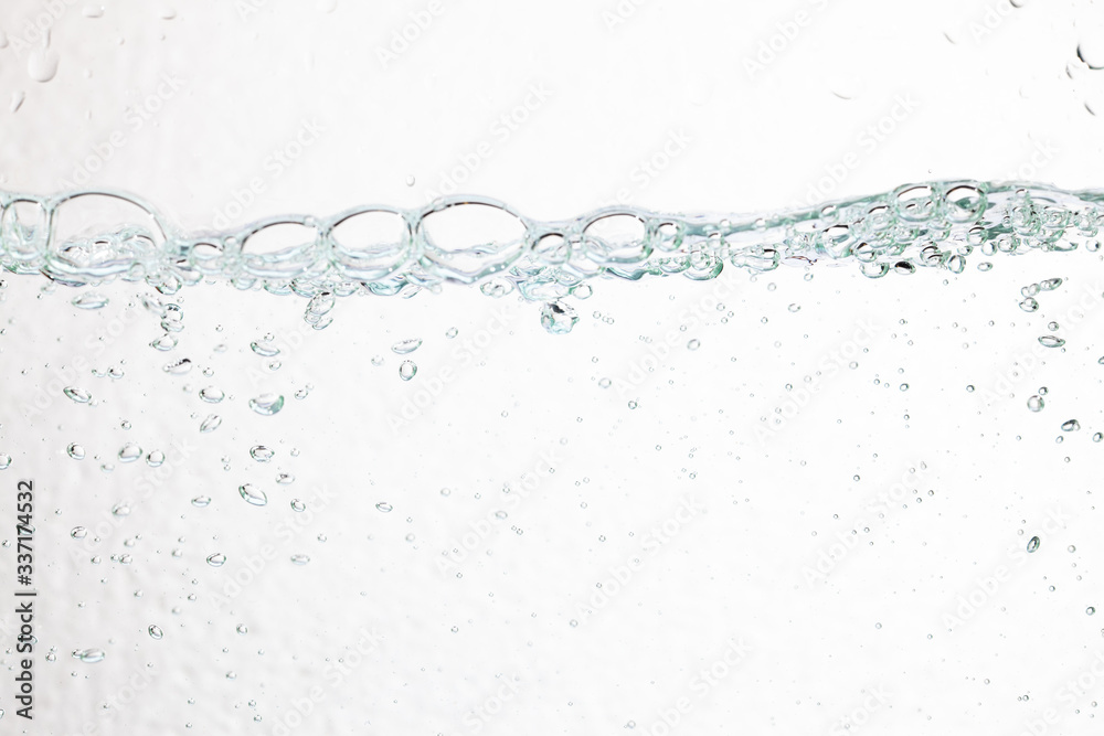 Closeup bubbles underwater on white background.