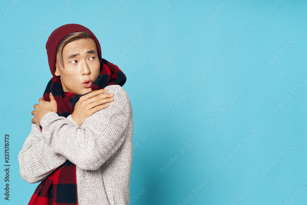 portrait of a young man wearing a red sweater portrait of a young man wearing a red sweater