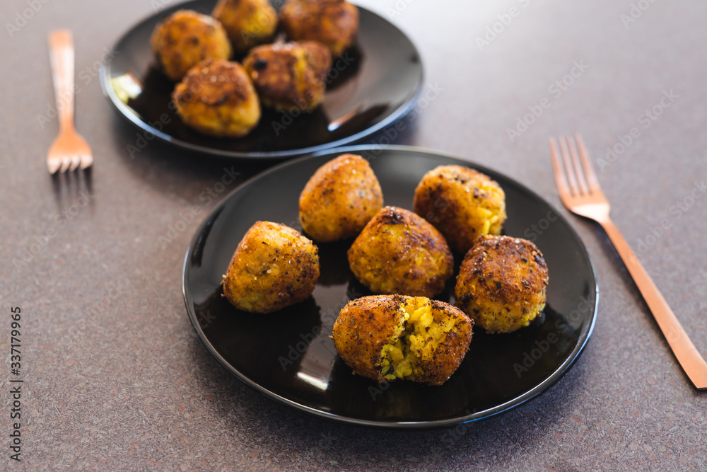 plant-based food, deep fried risotto arancini balls with vegan cheese filling