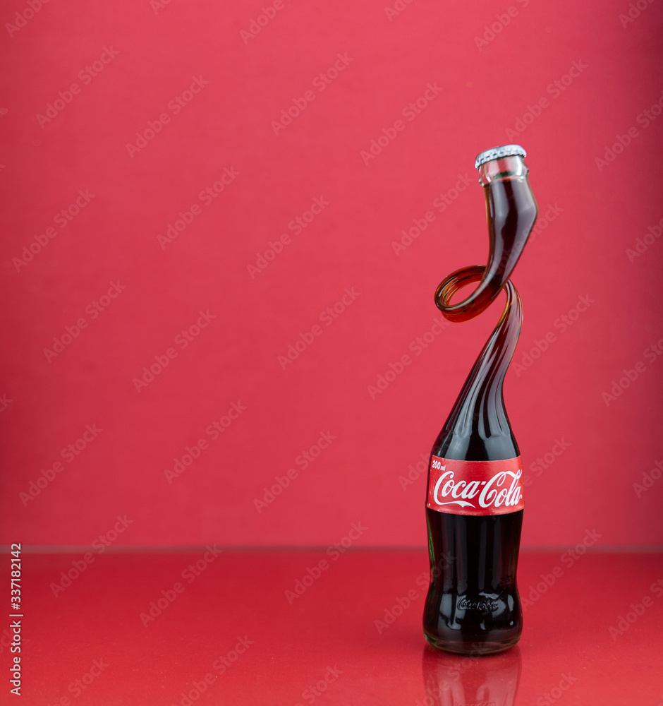 Atlanta, Georgia, USA - July 22, 2018: rare art coca-cola bottle with  designed form on red background in studio Photos | Adobe Stock