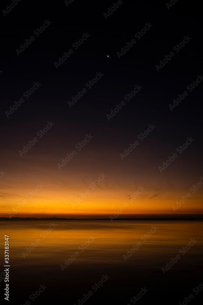 Fototapeta premium The sky with star at the lake in the twilight after sunset.