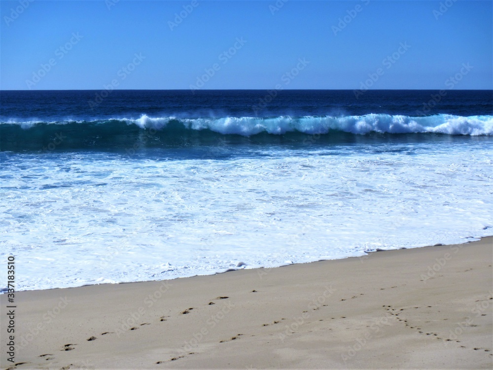 waves breaking on the beach