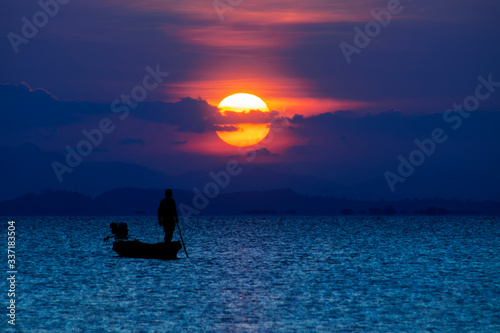 Fototapeta Naklejka Na Ścianę i Meble -  Minimal silhouette fishermans on the lake with twilight sky.