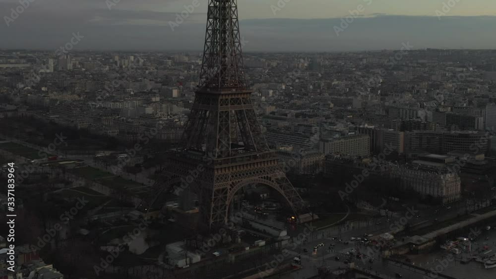 AERIAL: Drone Slowly Circling Eiffel Tower, Tour Eiffel in Paris, France with view on Seine River in Beautiful Sunset Light 