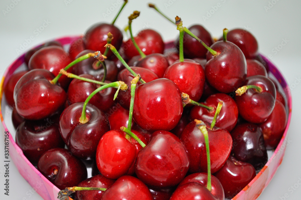 Pile of fresh red cherries with stems Pile of fresh red cherries with stems
