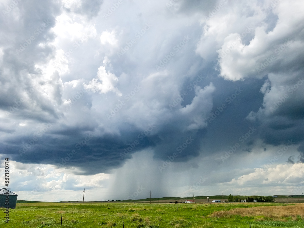 Strong storm over an open farm field Strong storm over an open farm field