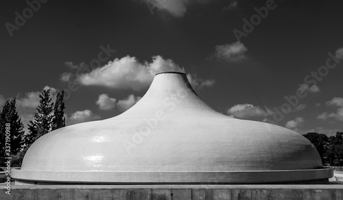 dramatic black and white image of museum roof in Israel, where desd sea scrolls are kept. photo