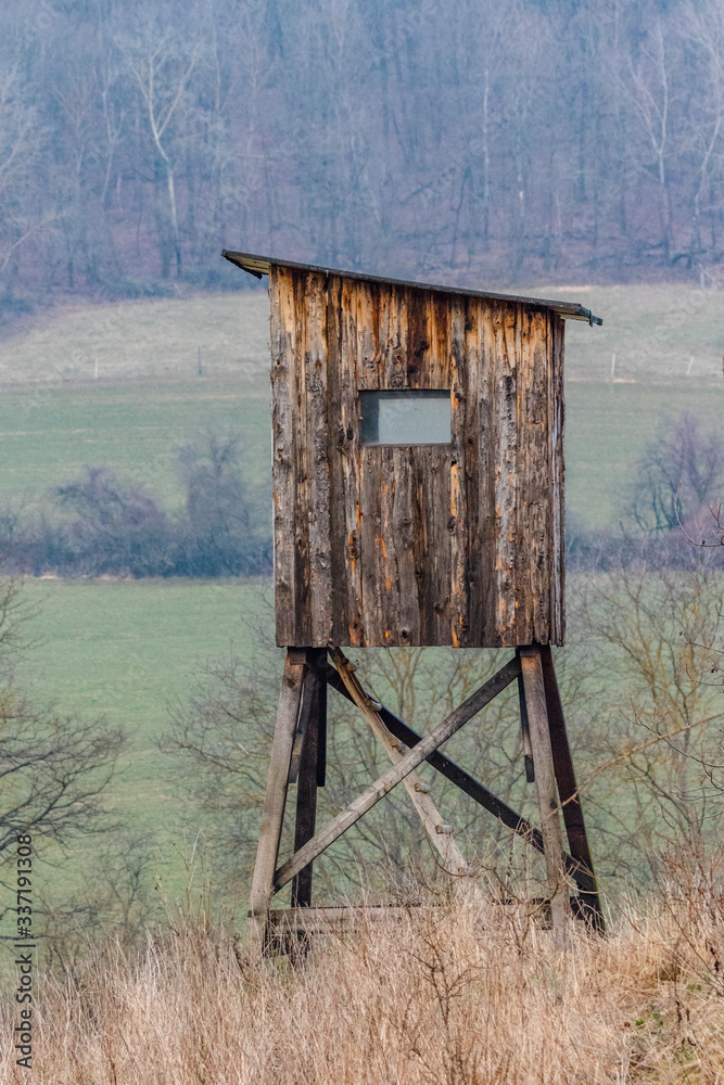 Wooden hunters observation point lookout for hunting animals near forest Wooden hunters observation point lookout for hunting animals near forest