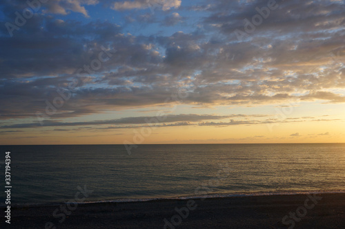 Landscape with sunset on the sea coast