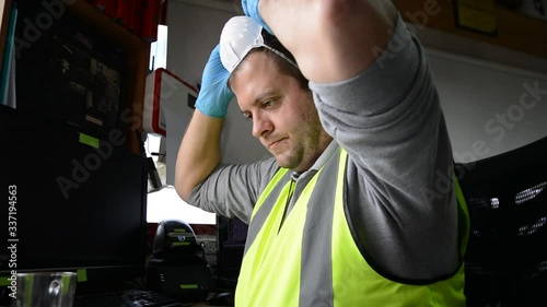Man with medical face mask and gloves drink coffee on workplace