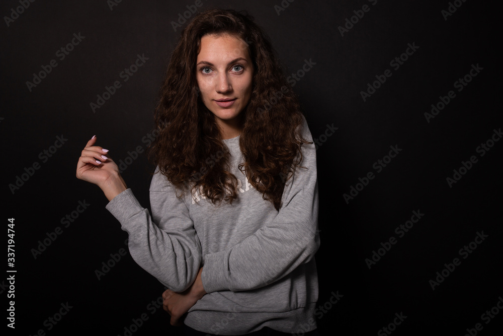 Beautiful girl with perfect long curly hair posing on photoshoot Beautiful girl with perfect long curly hair posing on photoshoot