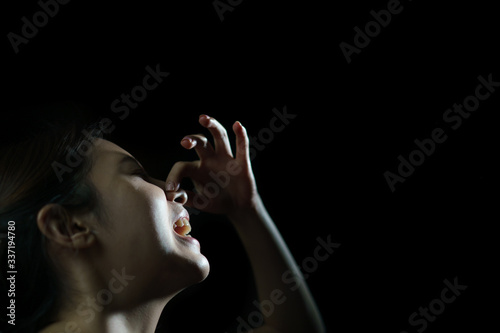 Woman coughing or sneezing. Concept of spread of the virus. Spray infection photo