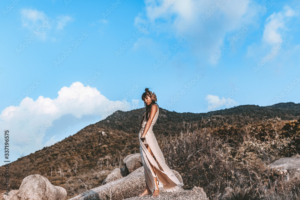 beautiful young stylish woman in elegant dress outdoors at sunset