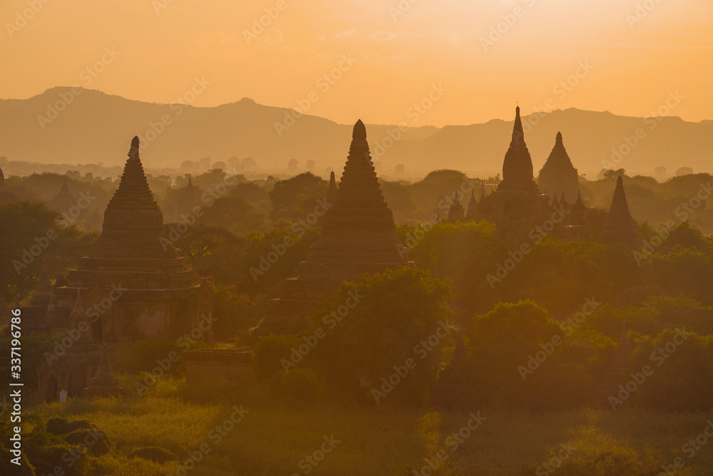 Buddhist temples of ancient Bagan on orange evening. Burma (Myanmar)