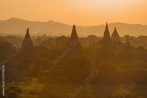 Buddhist temples of ancient Bagan on orange evening. Burma  Myanmar 