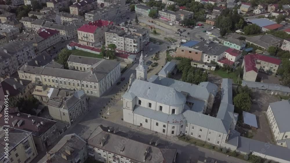 Aerial view to Church of the Assumption of Blessed Virgin Mary and center of historical city Zolochiv, Lviv region, Ukraine Aerial view to Church of the Assumption of Blessed Virgin Mary and center of historical city Zolochiv, Lviv region, Ukraine