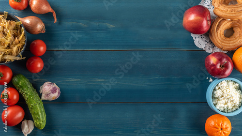 Fruits  vegetables and food on wooden background. Flat lay. Copy space.