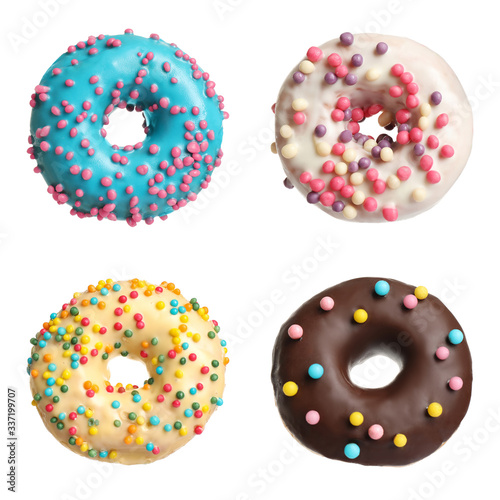 Set with delicious glazed donuts on white background