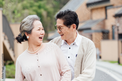 Asian aged couple walking in the area photo