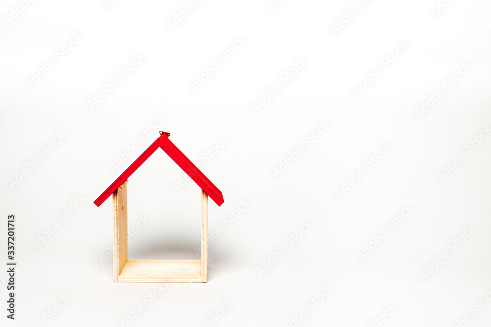 Wall decoration with house shape made from wood isolated on white background. Stay at home concept photo during Covid-19 pandemic. Wall decoration with house shape made from wood isolated on white background. Stay at home concept photo during Covid-19 pandemic.