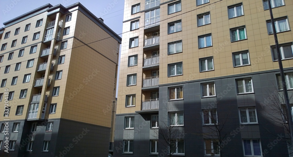 custom made wallpaper toronto digitalFacade of a new multi-story residential building. Rising prices for the purchase, sale and rental of real estate. Economy class apartments and comfortable housing. Cityscape. City living. Stay at home