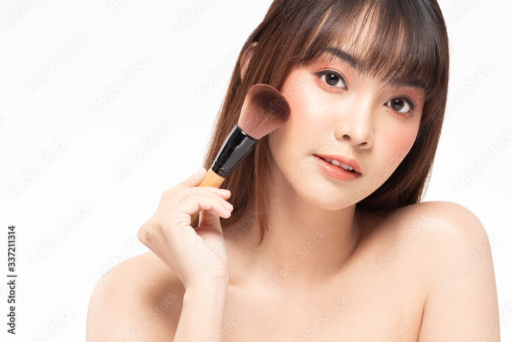 Beauty asian woman brown hair looking smile in camera happiness and hold make up brush and cheerful with make up brush,Beauty Concept on white background. Beauty asian woman brown hair looking smile in camera happiness and hold make up brush and cheerful with make up brush,Beauty Concept on white background.