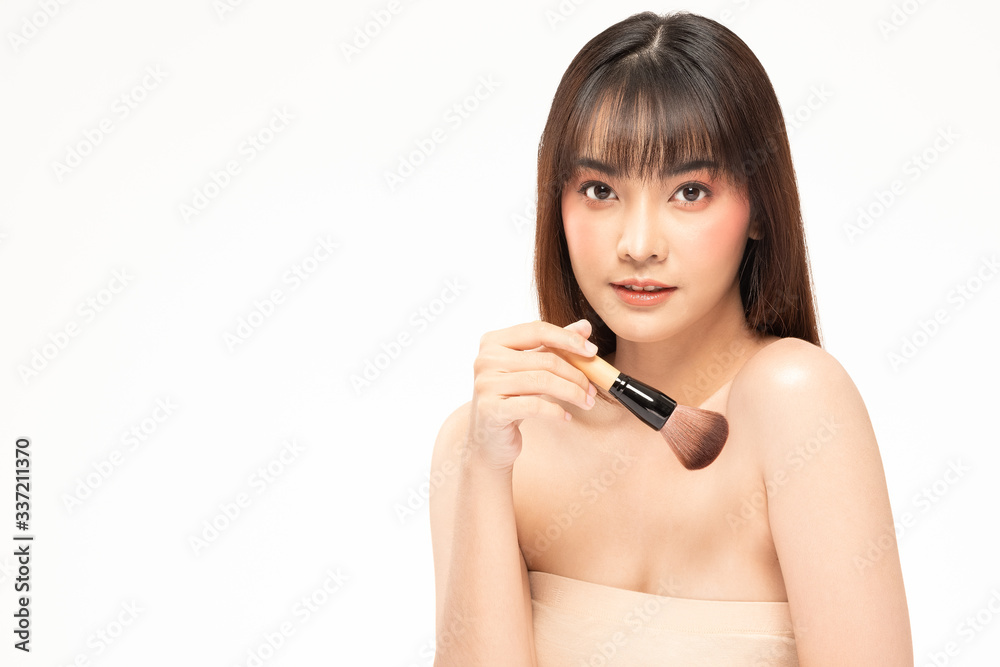 Beauty asian woman brown hair looking smile in camera happiness and hold make up brush and cheerful with make up brush,Beauty Concept on white background. Beauty asian woman brown hair looking smile in camera happiness and hold make up brush and cheerful with make up brush,Beauty Concept on white background.