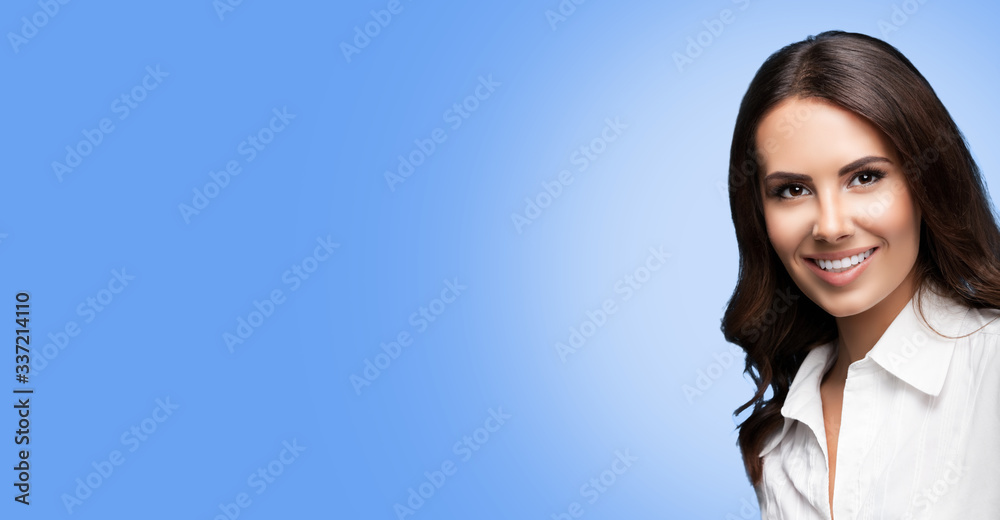 Happy smiling attractive young confident businesswoman, with copy space for some slogan or text. Success in business concept. Light blue color background. Happy smiling attractive young confident businesswoman, with copy space for some slogan or text. Success in business concept. Light blue color background.