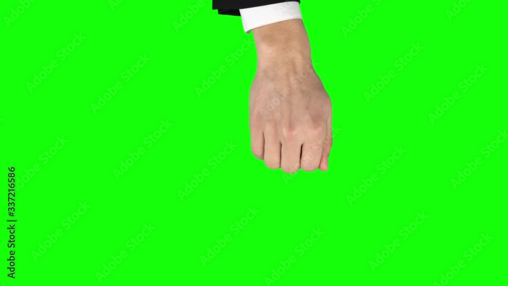 Man hand in black jacket and white shirt is performing 3x Swipe Up at tablet screen gesture on green screen. Close up Man hand in black jacket and white shirt is performing 3x Swipe Up at tablet screen gesture on green screen. Close up