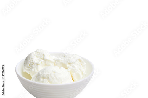 white bowl with white ice cream isolated on a white background.
