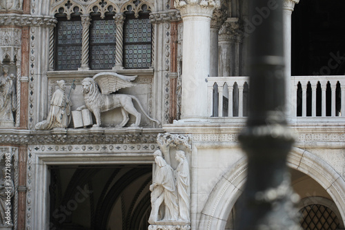 Decoration marvellous lion and king sculpture and painting in front of Beautiful art christian Cathedral plaza square church in Venice,Italy, house of faithful god, travel destination backgrounds