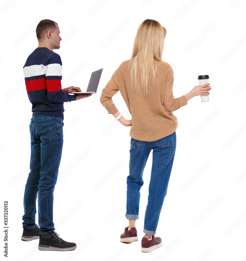 Back view couple with laptop in sweater. Back view couple with laptop in sweater.