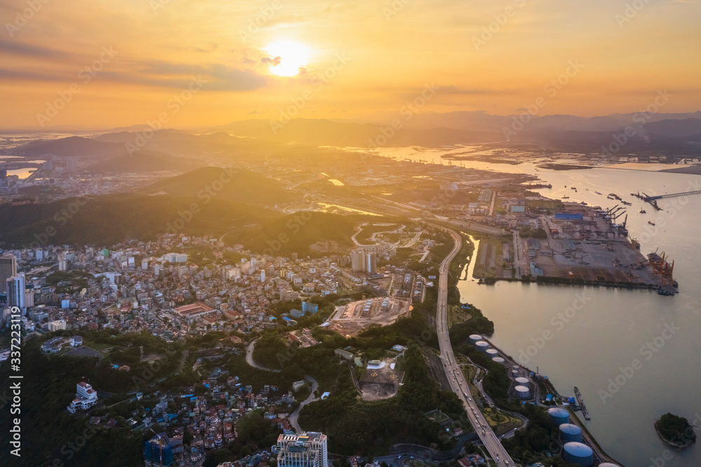 Aerial view of Bai Chay ward and Cai Lan Port. Ha Long City, Vietnam, with Sun World Halong park and Bai Chay bridge. Near Halong Bay, UNESCO World Heritage Site. View from Bai Chay bridge