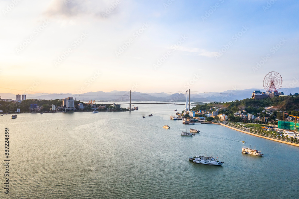 Aerial view of Bai Chay bridge. Near Halong Bay, UNESCO World Heritage Site. Popular landmark, famous destination of Vietnam. View from Ha Long bay to Cua Luc bay