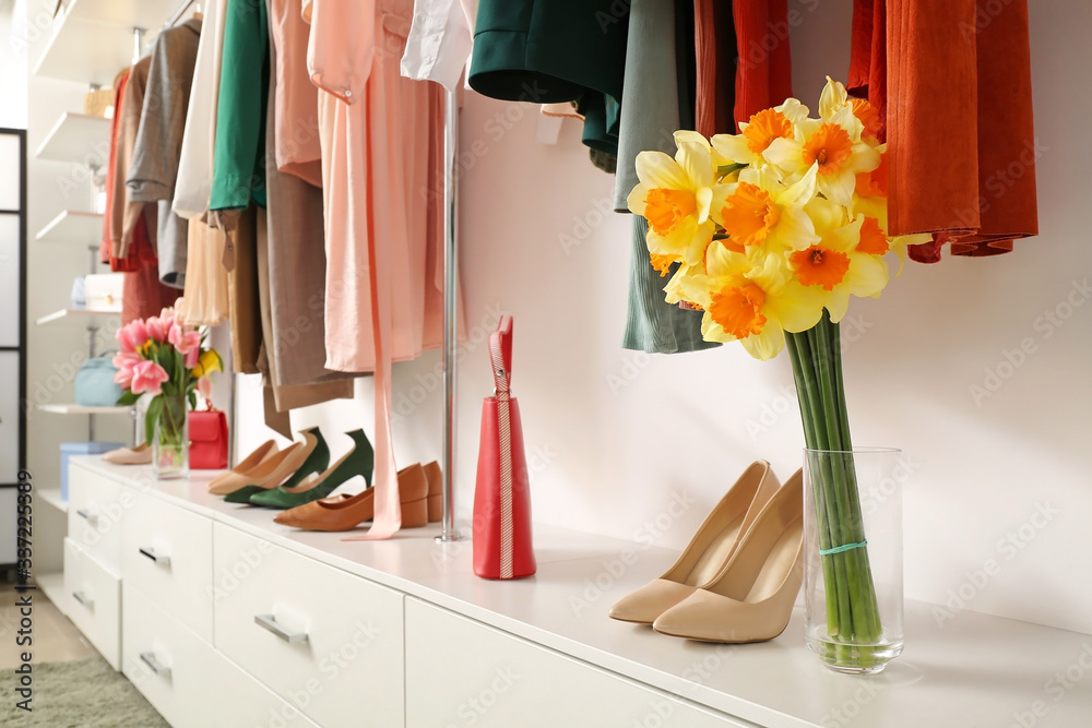 Modern wardrobe with stylish spring clothes and accessories Modern wardrobe with stylish spring clothes and accessories