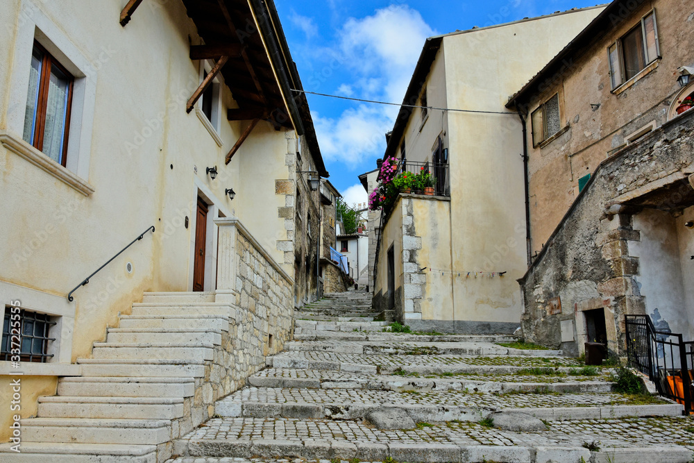 A narrow street between the houses of a tourist town in the Abruzzo region of Italy