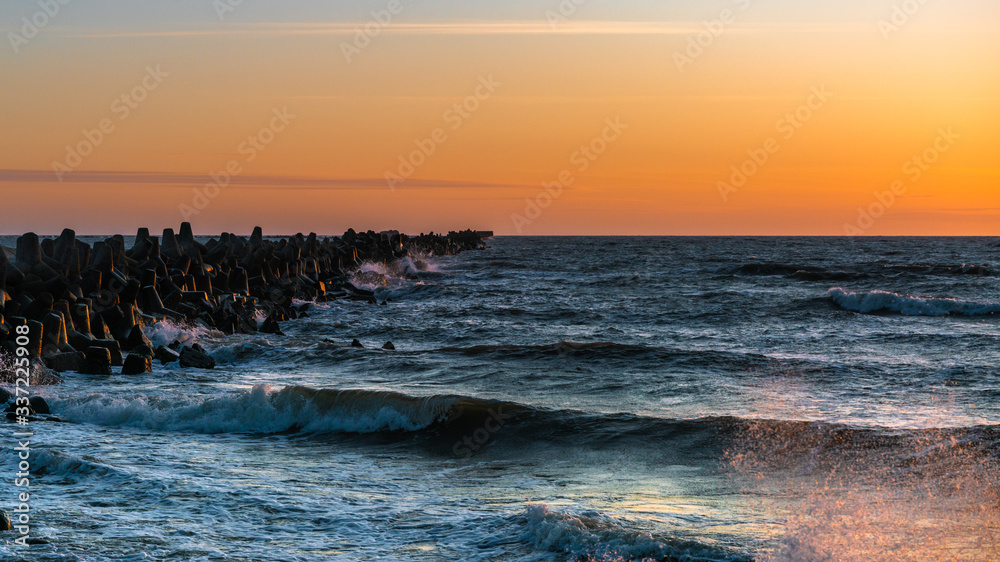 Panoramic view of the breakwater during sunset.