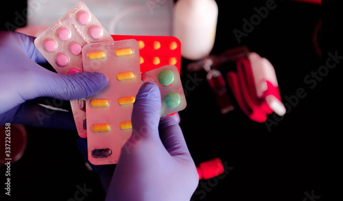 pills for a disease in the hands of a doctor