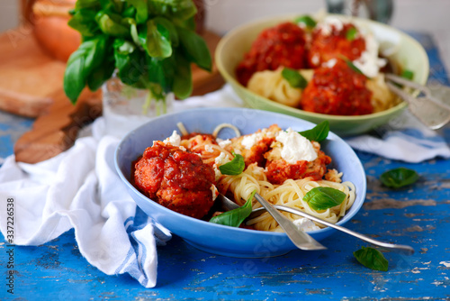 Turkey meat balls stuffed with feta cheese in tomato sauce