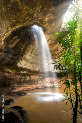 Sang Chan Waterfall (or called "Long Ru Waterfall") at Ubon Ratchathani in Thailand. The name of the waterfall is called by the nature of the stream that falls through the stone hole.
