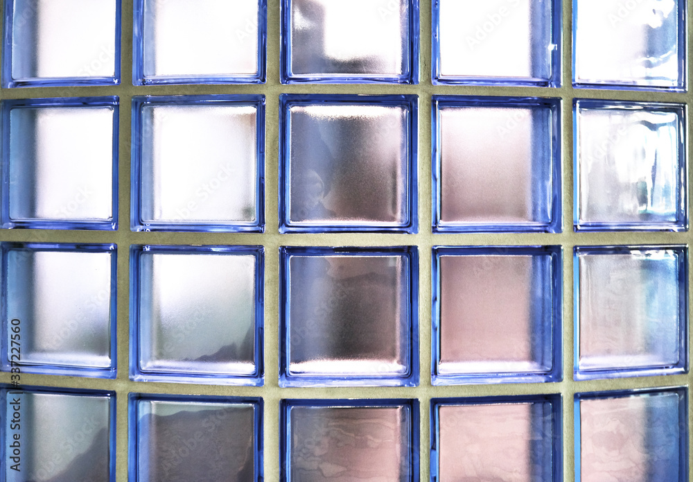 Wall made of colored glass blocks as an abstract background. Wall made of colored glass blocks as an abstract background.