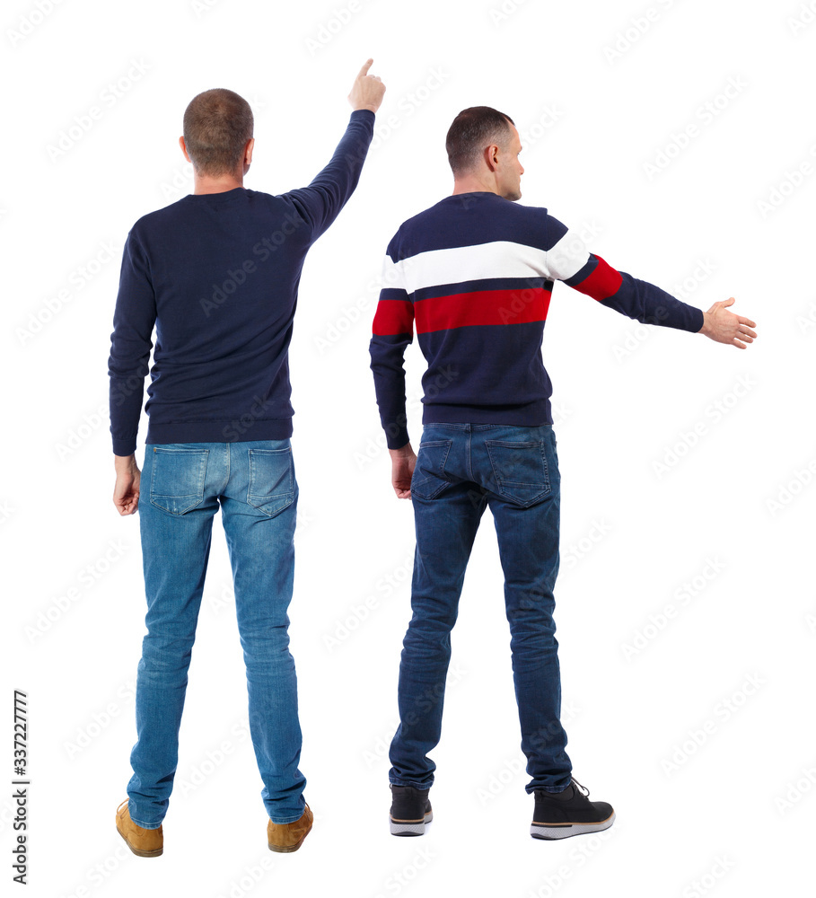 Obraz premium Back view of two man in sweater pointing.