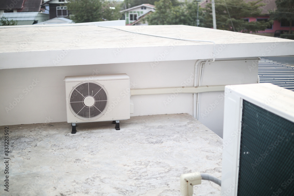 Air conditioner compressor outdoor unit installed outside the building ...