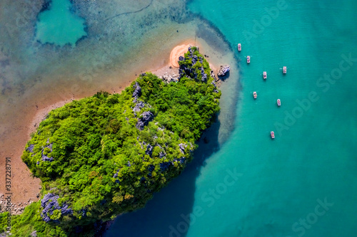 Aerial view Vung Vieng floating fishing village and rock island, Halong Bay, Vietnam, Southeast Asia. UNESCO World Heritage Site. Junk boat cruise to Ha Long Bay. Famous destination of Vietnam