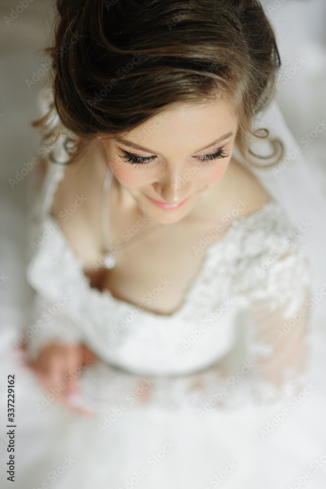 Portrait of a young beautiful bride shot from a high angle. Portrait of a young beautiful bride shot from a high angle.