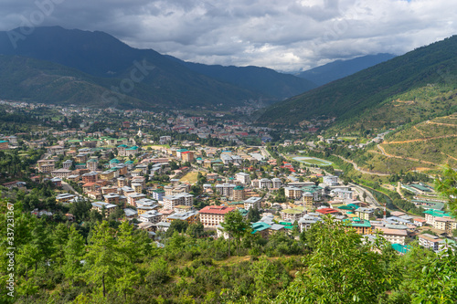 Top view Thimpu city, the capital of Bhutan surrounded by mountains in summer season © skazzjy