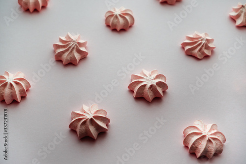 Pink meringue with rows on the same background