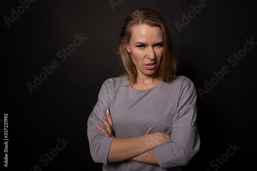 Caucasian transsexual standing with arm crossed. Dislike disgust consept