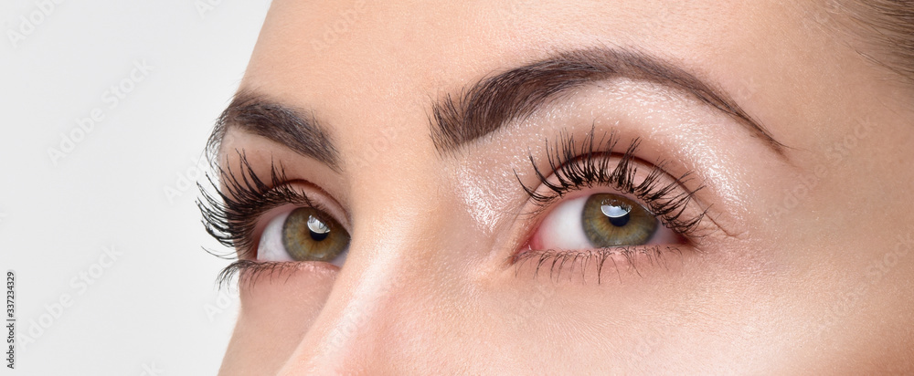 Closeup shot of woman eye with day makeup. Long eyelashes - obrazy, fototapety, plakaty 