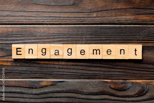engagement word written on wood block. engagement text on table, concept photo